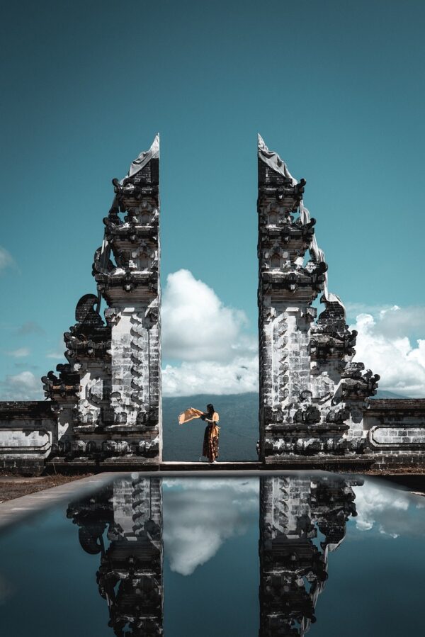 A woman standing in the Lempuyang temple gate